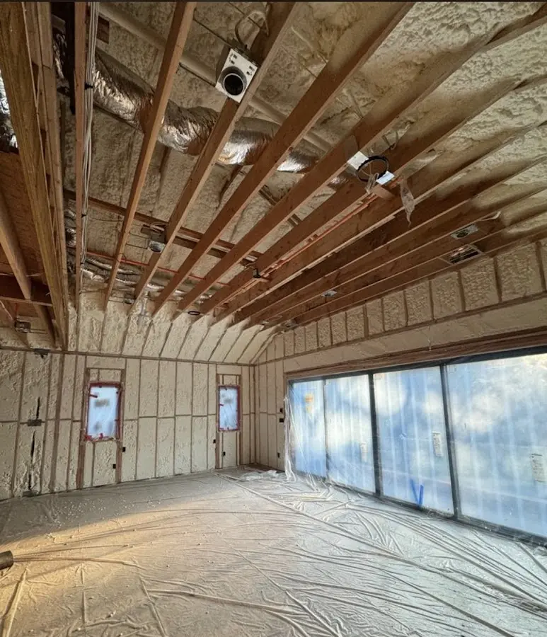 Interior walls and ceiling insulated with spray foam during new construction in Boulder